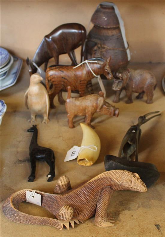 Ethiopian milk pot & cover, various Balinese & African carved wood animals, repro scrimshaw tusk & sundries